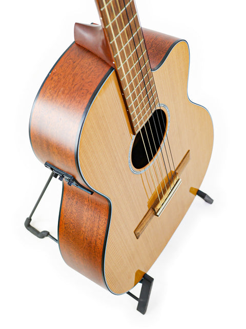 A Martin 000C-16SGCTNE guitar from 2003 displayed on a stand against a clean white background.