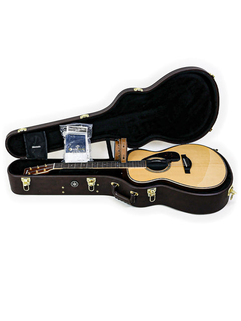 A Yamaha LS36 ARE guitar resting in its case, highlighting the beauty of Japanese craftsmanship from 2020.

