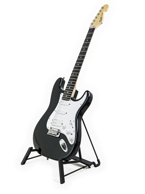 A black Fender Strat Plus Ultra guitar from 1993 displayed on a stand against a clean white background.
