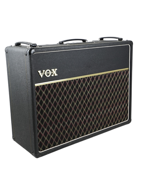 A black guitar amplifier case featuring two speakers, representing the iconic Vintage Vox AC-30 Top Boost from 1975.