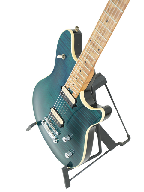 A blue background highlights a Peavey EVH Wolfgang Standard Hardtail guitar displayed on a stand.