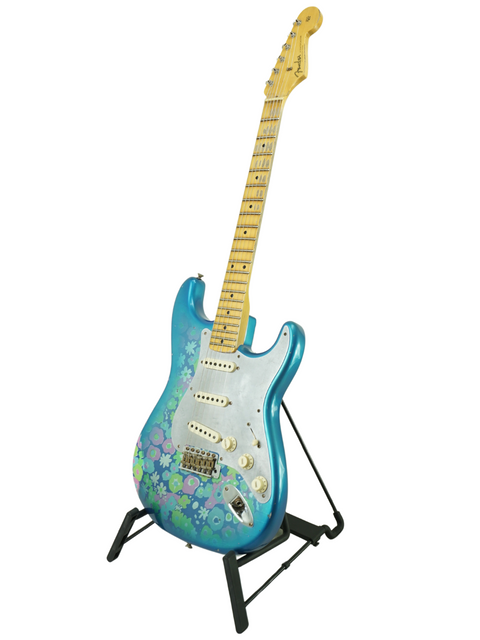 A blue guitar featuring floral designs, the Fender Custom Shop EL Diablo Strat Relic USA 2021, highlighting its artistry.