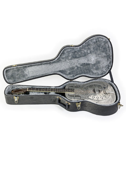 A classic 1934 National Style 'O' guitar in its case, displayed against a bright white backdrop.