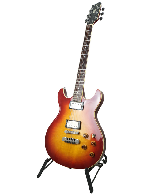 A classic 1984 Fender Esprit guitar in sunburst finish, resting on a stand, showcasing its vintage charm.