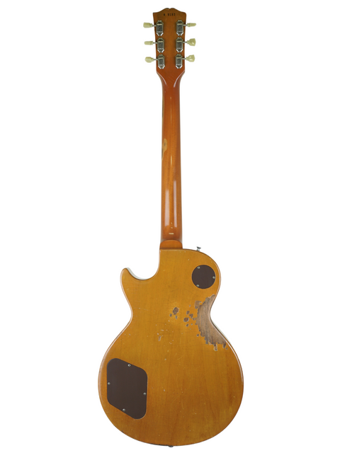 A classic Gibson Les Paul 1956 Reissue guitar, showcasing its wooden body and neck in a relic finish.