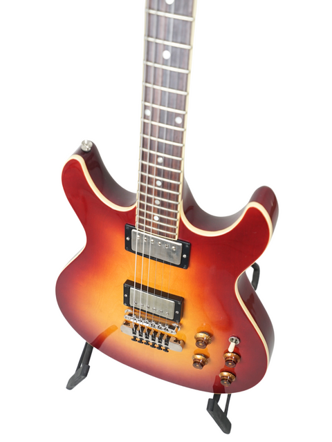 A classic red guitar with a sunburst finish, the 1984 Fender Esprit from Japan, blending style and vintage appeal.