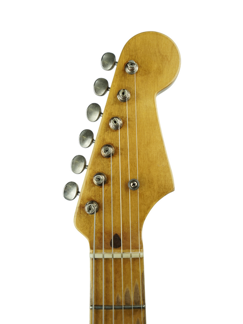 A close-up of the neck of a Nacho Guitars 50s Stratocaster, featuring a crisp white background for contrast.