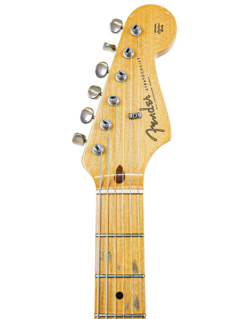 A close-up of the neck on a vintage 1985 Fender AVRI '57 Stratocaster, emphasizing its classic style and craftsmanship.
