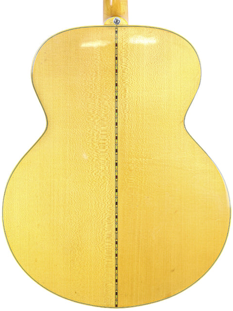 A natural-finished 1951 Gibson J-45 guitar, highlighting its vintage appeal and iconic status in music history.