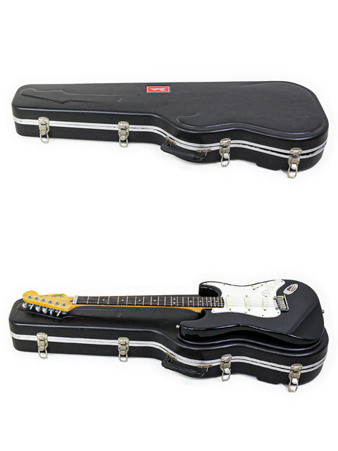 A pair of black cases housing a 1991 Fender Strat Plus guitar, displayed on a stark white backdrop.