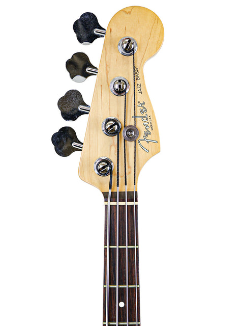 A pristine 2005 Fender Jazz Bass guitar featured on a white background, illustrating its iconic design and features.