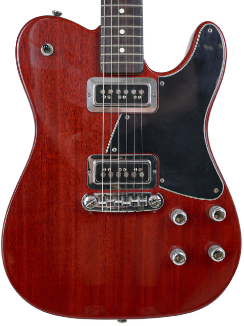 A red Fender Tele-Sonic electric guitar with a black pickguard, model year 2001, showcasing its sleek design.