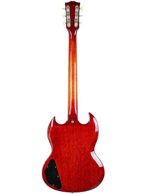 A red Gibson SG Special guitar from 1964/5, featuring a sleek black pickguard, exemplifying vintage musical elegance.