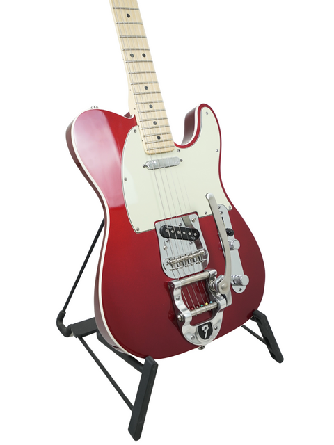 A red electric guitar with a white pickguard on a black stand, isolated on a white background.