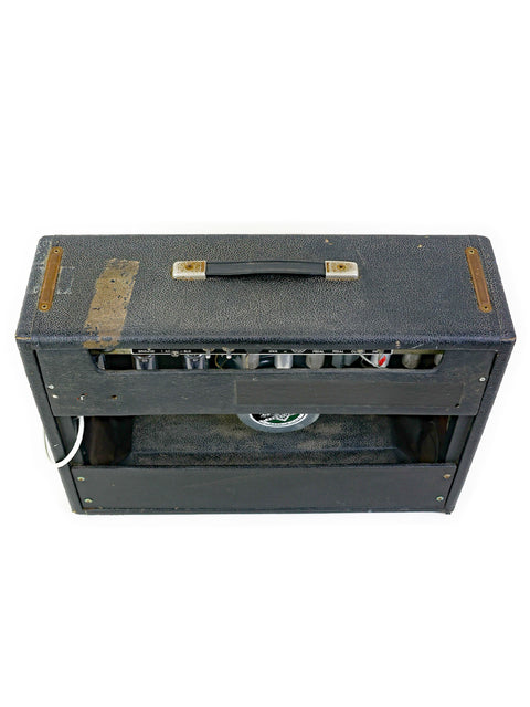 A retro Fender Deluxe Reverb amplifier from 1965, featuring a black case and a 1 x 12" speaker for timeless audio quality.