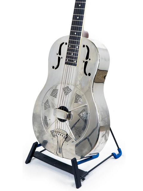 A silver National Resophonic Style N Resonator guitar elegantly positioned on a stand, contrasted by a blue background.