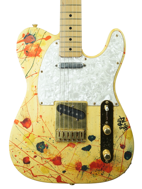 A striking paint splatter design on a 1994 David Hart Pro Hart Telecaster guitar, highlighting its artistic flair.
