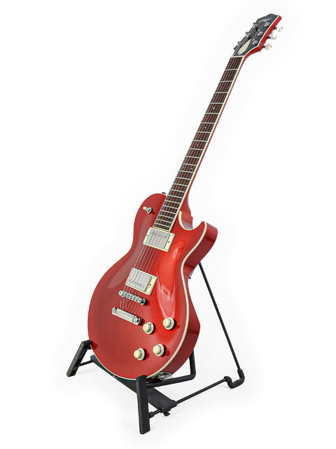 A striking red electric guitar, the Collings CL Deluxe from 2019, elegantly displayed on a stand.