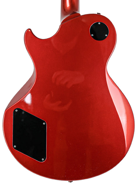 A striking red guitar, the Collings CL Deluxe from 2019, featuring a stylish black headstock that enhances its aesthetic appeal.
