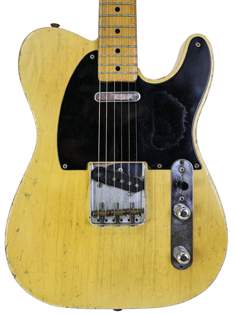 A striking yellow 1962 Fender Telecaster, featuring the iconic 'Blackguard' style from the original 1954 USA model.