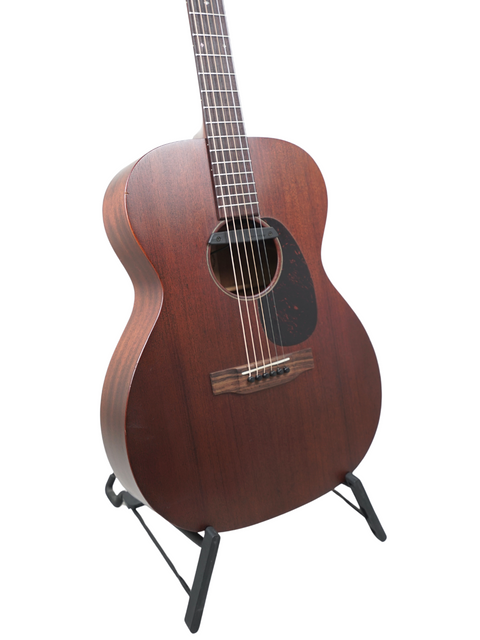 A stunning 2016 Martin 000-15M acoustic guitar resting on a stand, highlighting its elegant wooden craftsmanship.