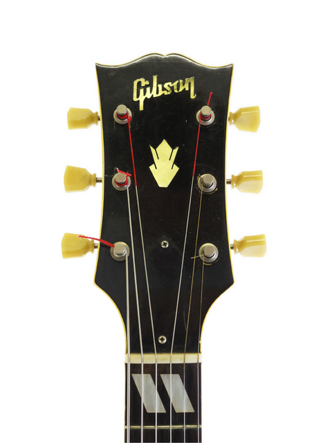 A stunning Gibson Les Paul Custom '59, highlighting its vintage appeal, paired with a 1952 Gibson ES-300 guitar.