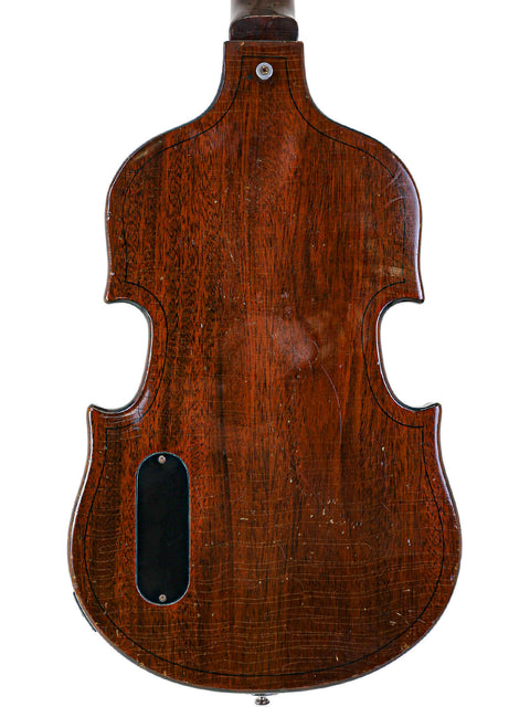 A stunning wooden back of a 1969 Vintage Gibson EB-1 guitar, reflecting its timeless craftsmanship and vintage appeal.
