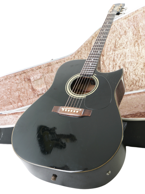 A stylish black acoustic guitar with its case, the vintage Maton Tommy Emmanuel 'Ebony' Signature model from 1989, AUS.