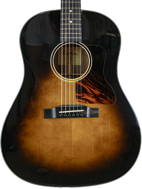A sunburst acoustic guitar with a visible label inside the soundhole.