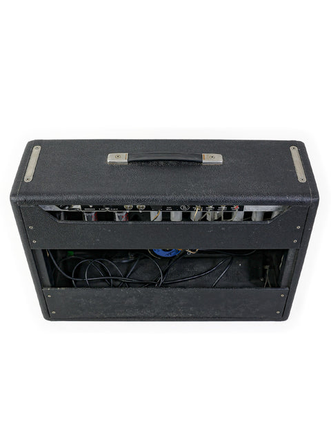 A vintage 1967 Fender Deluxe Reverb Blackface combo amplifier cabinet, showcasing multiple wires and cables.