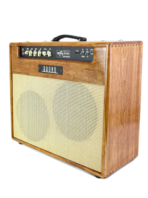 A vintage Bruno guitar amplifier with control knobs on a white background.