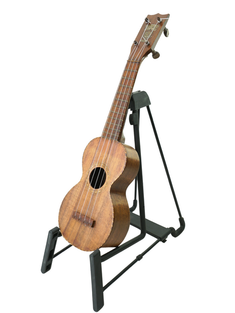 A vintage Hawaiian Kumalae Model D ukulele, c. 1920, positioned gracefully on a stand for display.