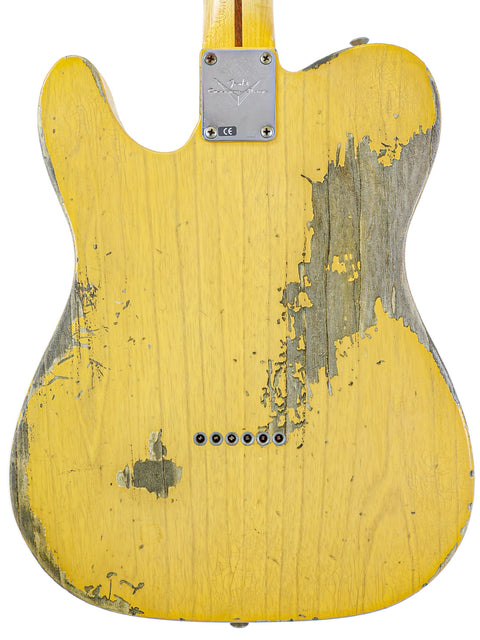 A weathered yellow Fender Custom Shop '53 Telecaster Heavy Relic guitar, USA-made in 2017, highlighting its aged paintwork.