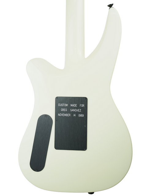 A white electric guitar featuring a black sticker on the back, model Jackson Phil Collen Signature PC1 Archtop from 1989.