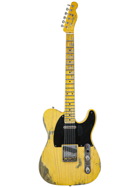 A yellow Fender Custom Shop '53 Telecaster Heavy Relic guitar with a black pickguard, showcasing its vintage design.