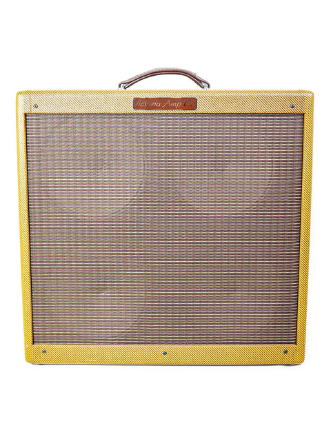 A yellow Fender guitar amp featuring a brown leather strap, model Victoria 45410-T 'Bassman', USA, 2007 edition.