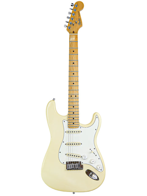 A yellow electric guitar with a white pickguard and maple neck.