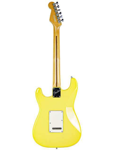 A yellow electric guitar with a white pickguard displayed against a white background.
