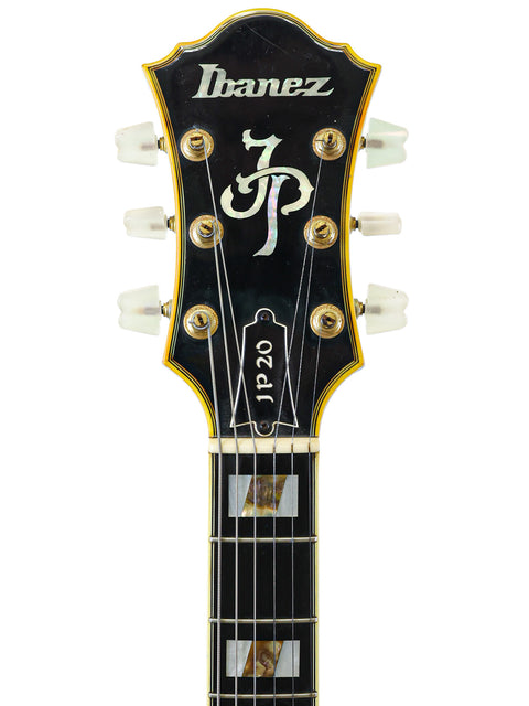 An Ibanez JP20 Joe Pass Signature guitar from Japan, 1982, showcasing the brand name elegantly on its polished surface.
