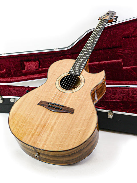 An elegant guitar housed in a case, marked Gary Rizzolo SJ Custom, Australia 2013, representing fine artistry.
