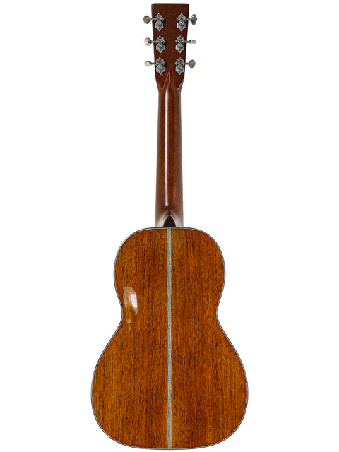 Back view of a Martin Sting Mini Signature Edition acoustic guitar, showcasing its wooden back and Sting's signature.