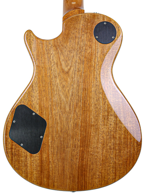  Back view of a PRS McCarty Singlecut 594 electric guitar with a beautiful wooden body, showcasing its craftsmanship.