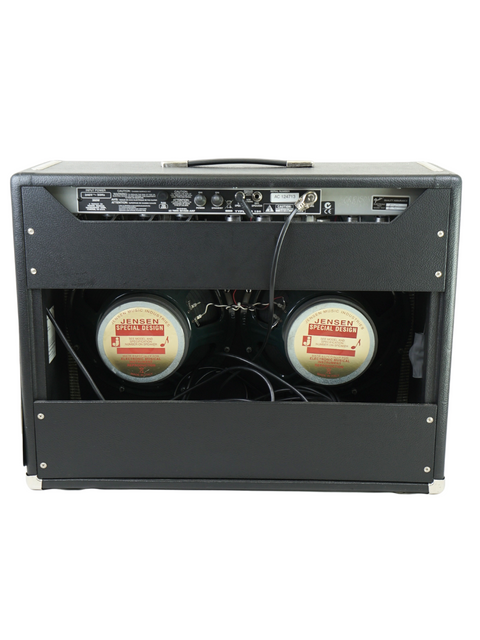 Back view of a black guitar amplifier with two visible Jensen speakers and multiple input jacks.