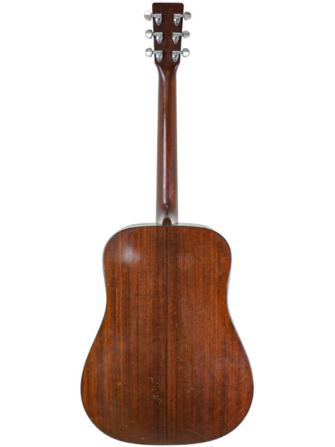 Back view of a vintage 1974 Martin D-18 acoustic guitar, showcasing its classic wood grain and craftsmanship.