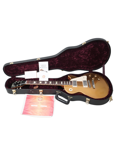 Beautiful Gibson Les Paul Custom Goldtop guitar, 2003 model from the Custom Shop, highlighting its vintage appeal and craftsmanship.