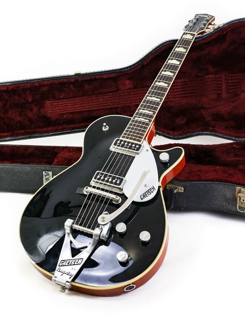 Beautiful Gretsch Duo Jet 6128TSP in black, red, and white; a 1957 reissue from Japan, a must-have for any guitar lover.

