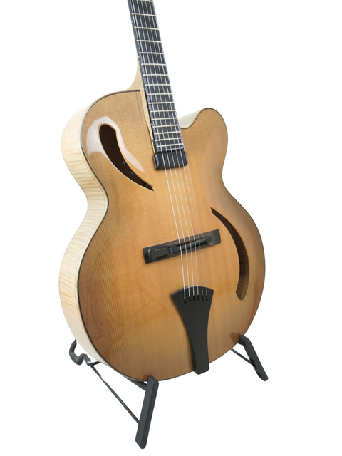 Beautiful Hancock Phantom Custom Archtop guitar on a stand, a must-have for any musician wanting premium craftsmanship.