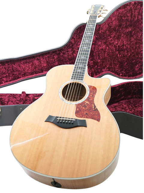 Beautiful Taylor 616ce grand acoustic guitar, made in the USA in 2011, known for its rich tones and elegant design.