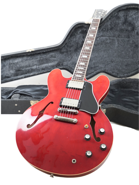 Beautiful red Gibson ES-335 guitar in its case, perfect for those wanting a blend of classic design and modern performance.
