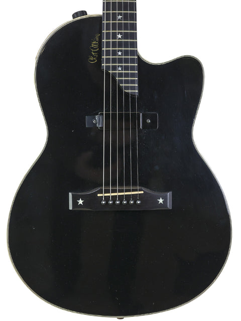 Black Gibson Chet Atkins SST guitar featuring a white pickguard, made in the USA in 2001.